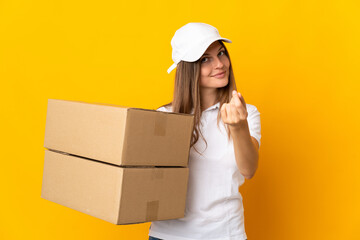 Young Slovak delivery woman isolated on yellow background making money gesture - obrazy, fototapety, plakaty