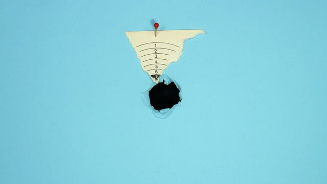 Bullet hits the center of bullseye. Clean hit, aiming, hit in the middle, concept. 4K stop motion animation.