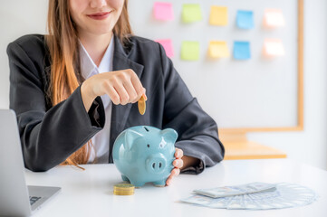 Business caucasian woman putting coin into piggy bank, step up start up business to success, Saving money for future plan and retirement fund concept