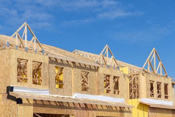 walls and rafters of a new plywood house