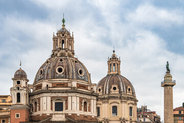 Fototapeta na wymiar View of the Church of the Maria al Foro Traiano and the famous column