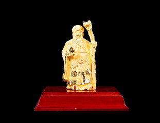 Figure of the Chinese monk of gold, isolated on black background