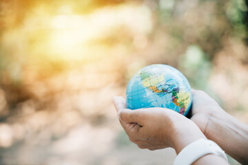 In the spirit of World Earth Day, embrace a green leaf and the globe to represent Green Energy, ESG, and Environmental Responsibility. Signify support and wisdom in caring for our planet.