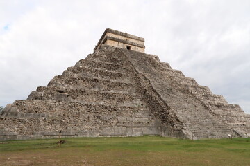 Fototapeta na wymiar The Kukulcan Pyramid, El Castillo, The Castle, view onto one of its destroyed facades, Chichen Itza, Valladolid, Mexico