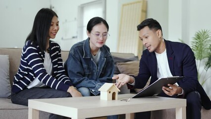 Real estate agent explaining about the house option and offering promotions to Couple, Mortgage, loan, property and insurance concept