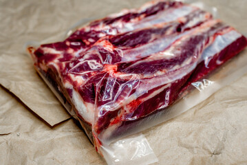 fresh beef in vacuum packaging on a background of kraft paper