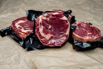 fresh beef in vacuum packaging on a background of kraft paper