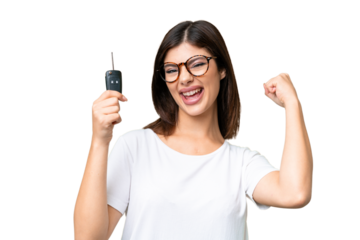 Young Russian woman holding car keys over isolated chroma key background celebrating a victory