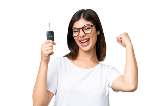 Young Russian woman holding car keys over isolated chroma key background celebrating a victory