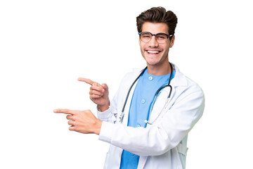 Young doctor man over isolated background pointing finger to the side and presenting a product