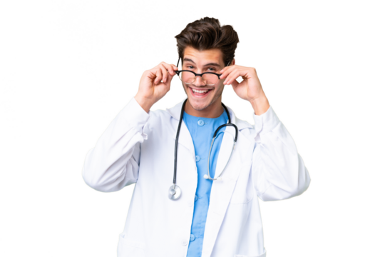 Young doctor man over isolated background with glasses and surprised