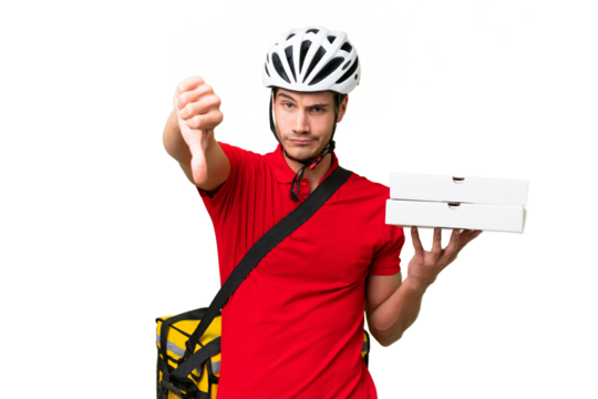 Pizza delivery man with work uniform picking up pizza boxes over isolated background showing thumb down with negative expression