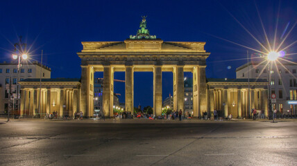 Fototapeta na wymiar Brandenburg Arch in Berlin illuminated in the night sky