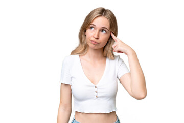 Young English woman over isolated background making the gesture of madness putting finger on the...