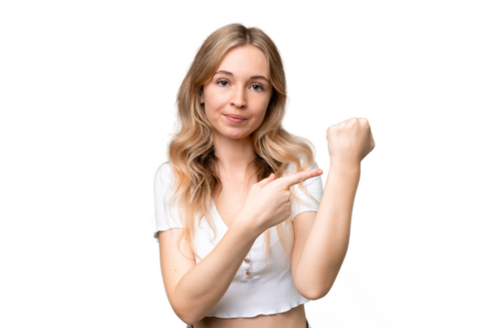 Young English woman over isolated background making the gesture of being late