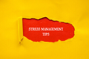 Stress management tips lettering on ripped yellow paper with red background. Conceptual mental...
