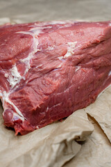 fresh beef in pieces on a background of kraft paper