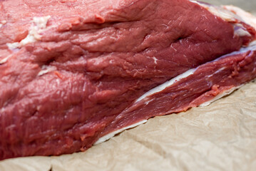 fresh beef in pieces on a background of kraft paper