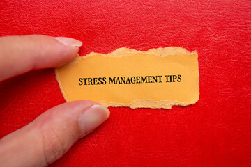 Stress management tips lettering on ripped orange paper piece with red background. Conceptual mental health photo. Top view, copy space for text.