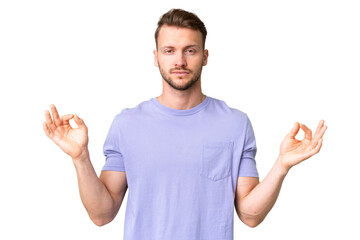 Young handsome caucasian man over isolated chroma key background in zen pose