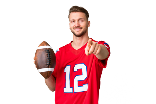 Young caucasian man playing rugby over isolated chroma key background pointing front with happy expression