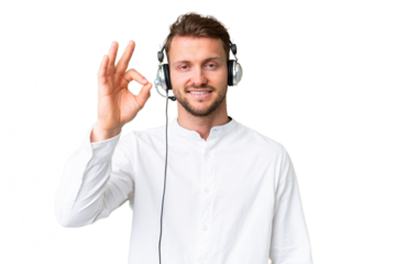 Telemarketer caucasian man working with a headset over isolated chroma key background showing ok sign with fingers
