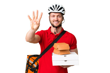 Young delivery man taking a takeaway food over isolated chroma key background happy and counting four with fingers