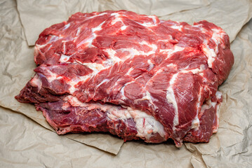 fresh beef in pieces on a background of kraft paper