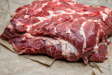 fresh beef in pieces on a background of kraft paper