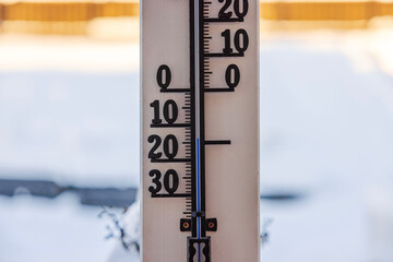 Close-up view of outdoor thermometer indicating minus 14 degrees Celsius. 