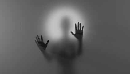 Blurred silhouette behind matte glass. Creepy Halloween concept.