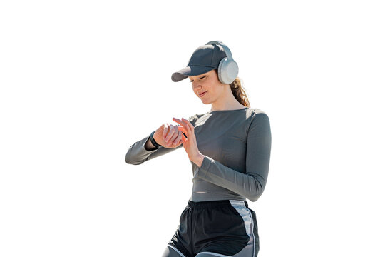 An athletic woman uses a fitness watch to watch the result after a workout. Transparent background.