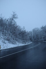 Snowy Road near the forest, winter background