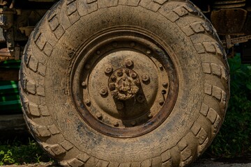 Fototapeta na wymiar old wheel of a Russian army truck
