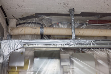 Asbestos removal off heating pipes - 704587413