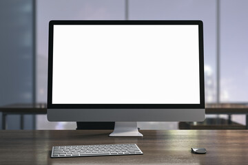 Contemporary designer desktop with white computer monitor, coffee cup, supplies, other objects and window with night city view in the background. Mock up, 3D Rendering.