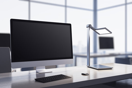 Modern bright designer desktop with computer monitor, coffee cup, supplies, other objects and window with city view in the background. Mock up, 3D Rendering.