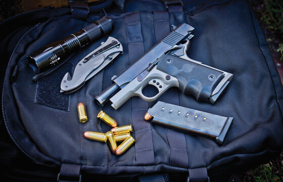 Deadly weapon handgun with knife EDC