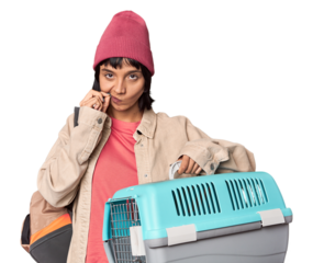 Young Hispanic woman ready for travel with pet carrier excited keeping ok gesture on eye.