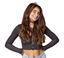 Young Caucasian woman in studio setting happy, smiling and cheerful.