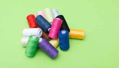 Various spools of sewing cotton thread of different colors