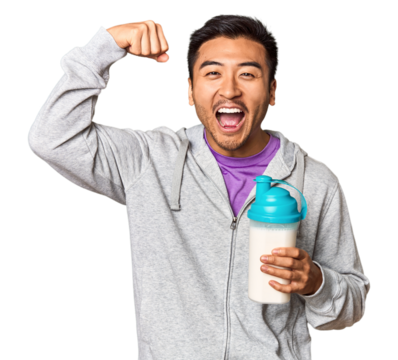 Fit Chinese male with protein shake and bottle in studio setup