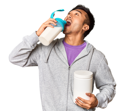 Fit Chinese male with protein shake and bottle in studio setup