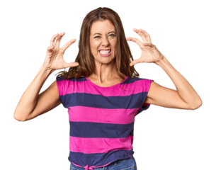 Middle-aged woman portrait in studio setting screaming with rage.