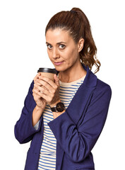 Middle-aged entrepreneur with takeaway coffee in studio