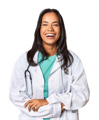 Young Filipina doctor with stethoscope in studio laughing and having fun.