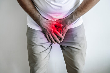 Pain in the groin and urination. Men's health and medicine concept. - obrazy, fototapety, plakaty