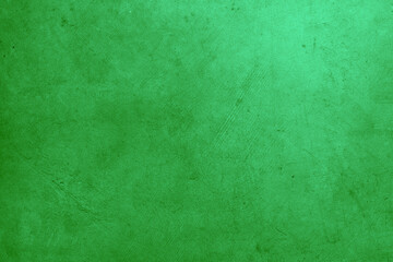 Fototapeta na wymiar Close-up of green textured concrete wall background