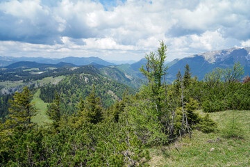 Obraz premium Small green hills and steep snowy mountains in Ötscherland, Lower Austria