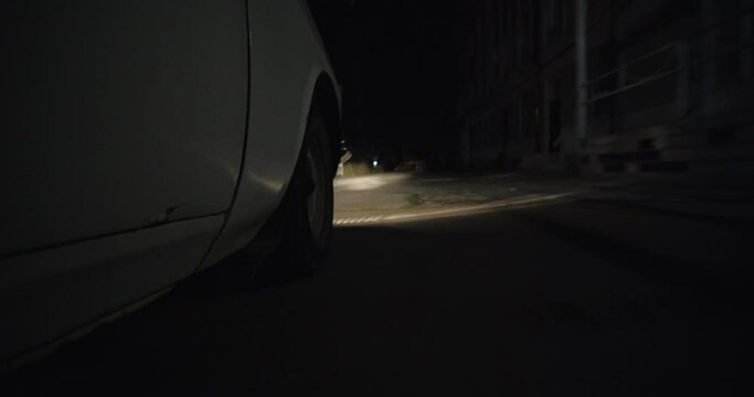 Poor Neighborhood Of Row Homes. Old Car during night. Crime abandoned area. 